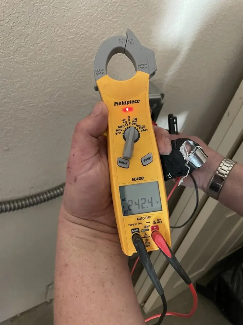 Voltage testing with clamp meter during Whole House Surge Protector in Huntington